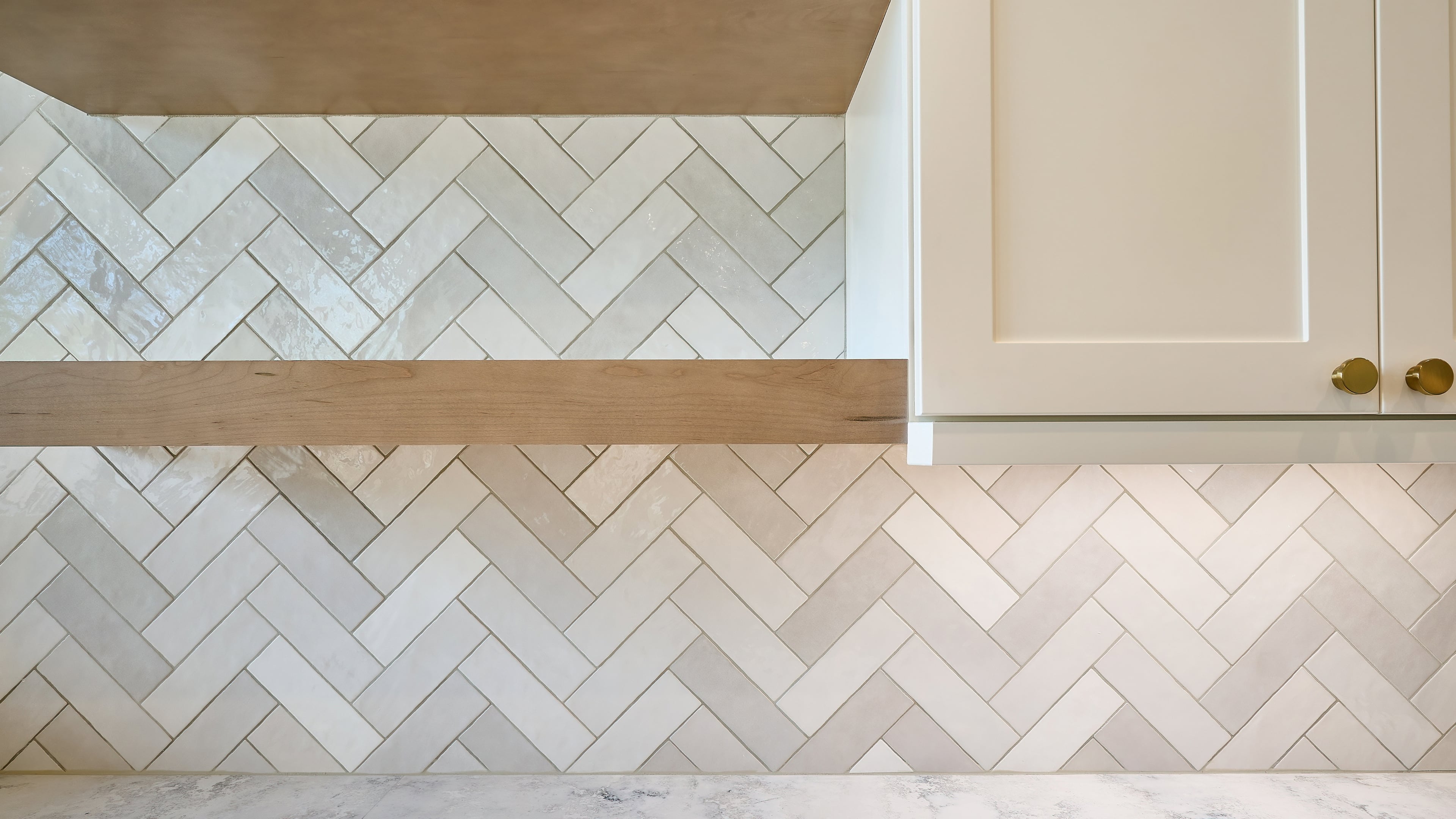 Herringbone tile detail — craftsmanship by Ty Simister Homes